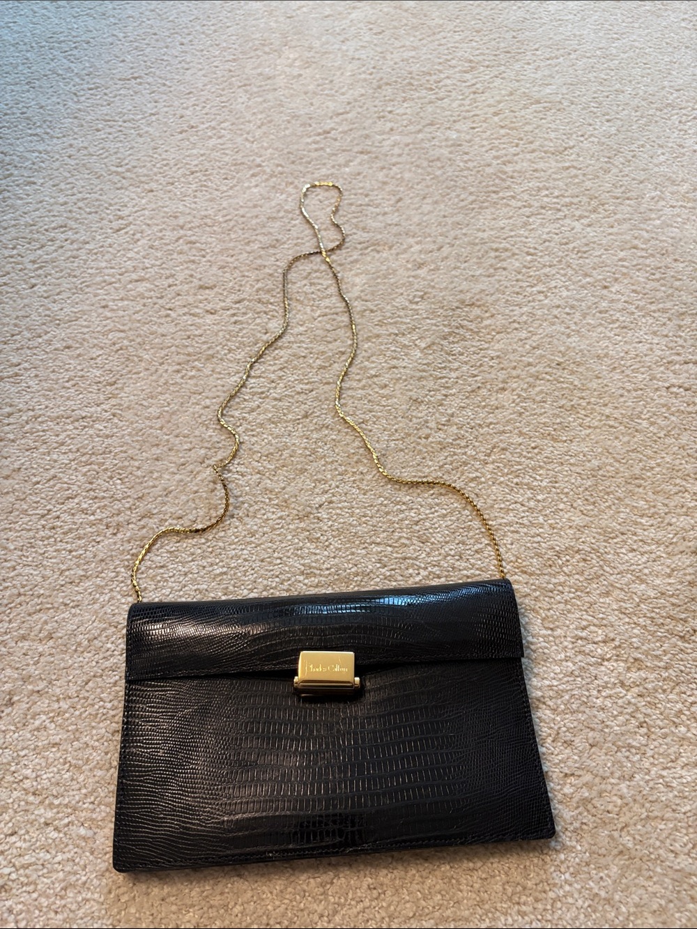 Black Leather Clutch with Gold Chain Strap by Salvatore Ferragamo